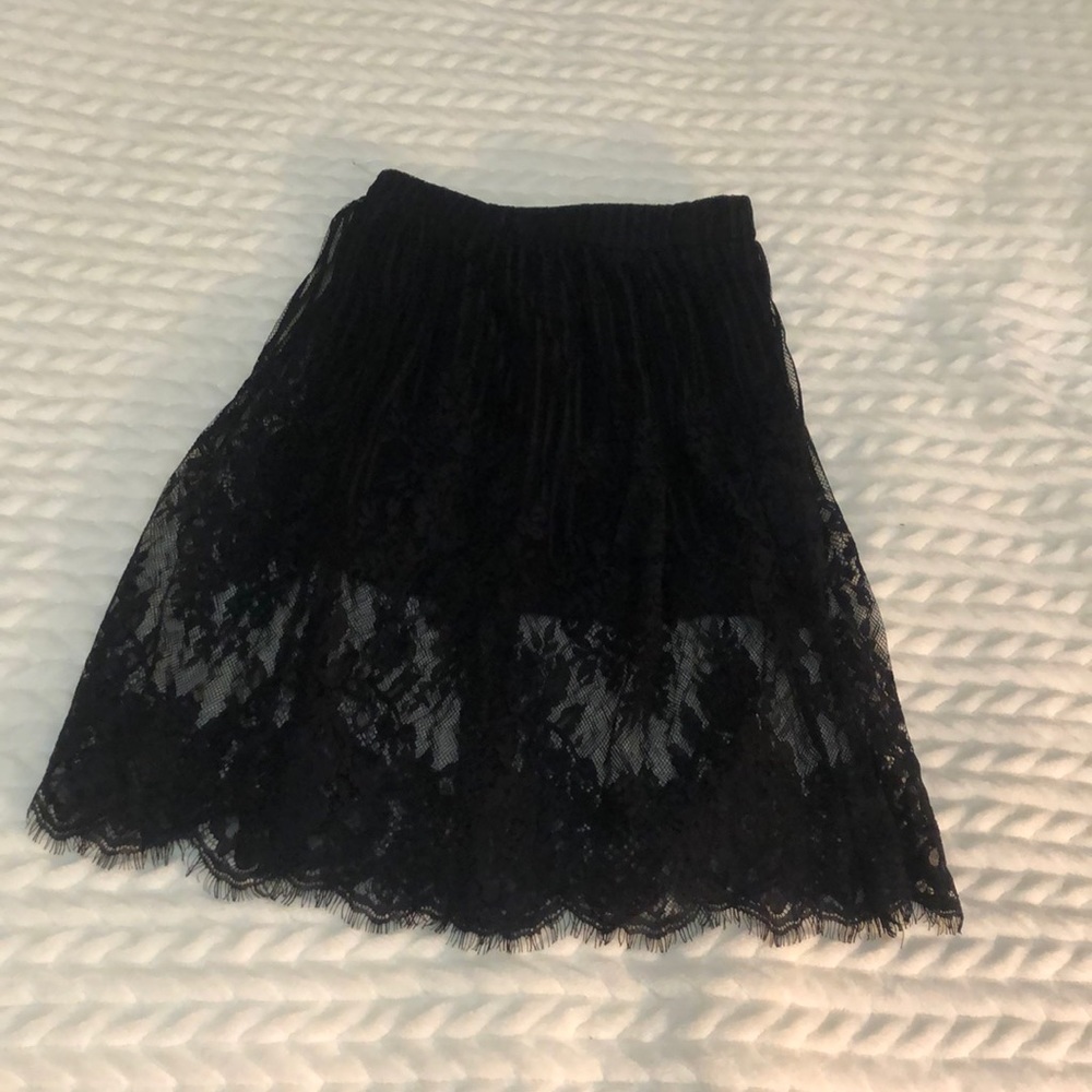 Black skirt with lace, lace ends about knee length